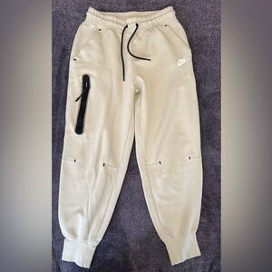 Tan Nike Tech woman size small athleisure joggers sweatpants with black accents